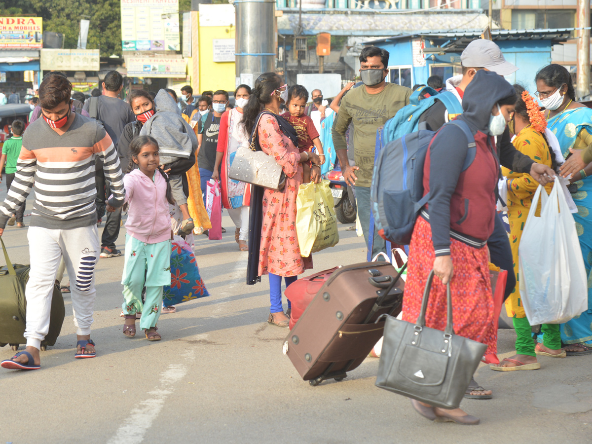 Huge Rush At Bus Stands Due To Sankranti Festival - Sakshi