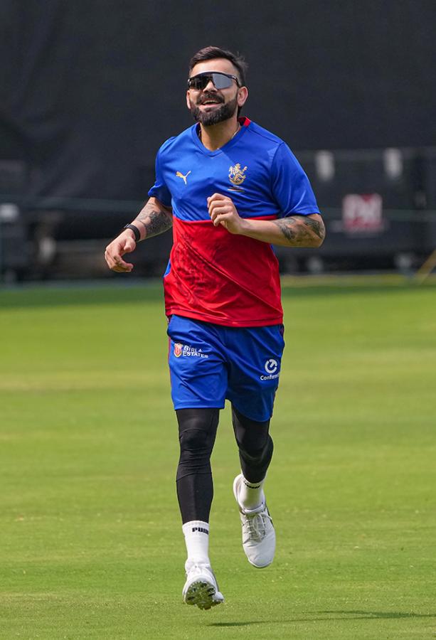 Virat Kohli during a training session ahead of the Indian Premier League - Sakshi