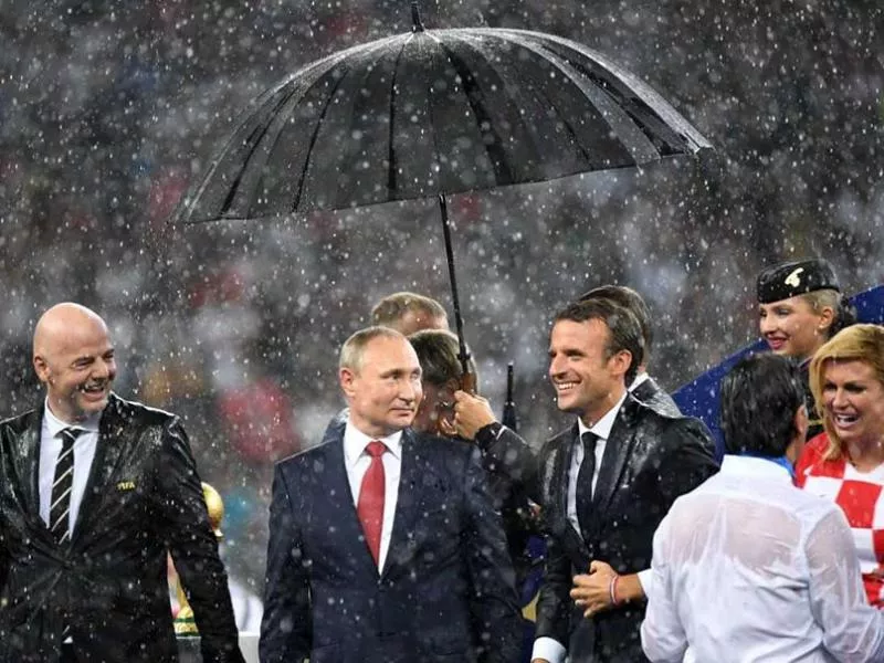 Vladimir Putins Umbrella Steals The Show At World Cup Final - Sakshi