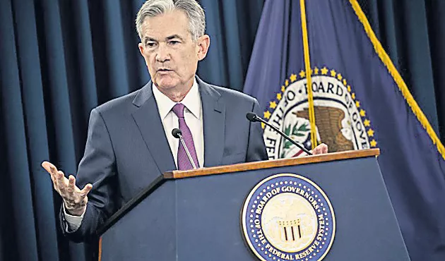 Fed hikes interest rates, raises its economic outlook and drops - Sakshi