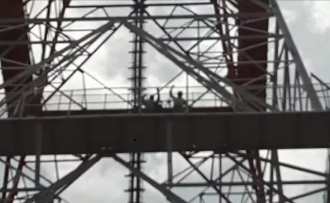 Two Members Climbs Cell Tower Demanding Gives MLA Ticket For Shankaramma - Sakshi
