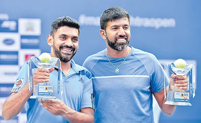 Rohan Bopanna and Divij Sharan lift doubles trophy - Sakshi