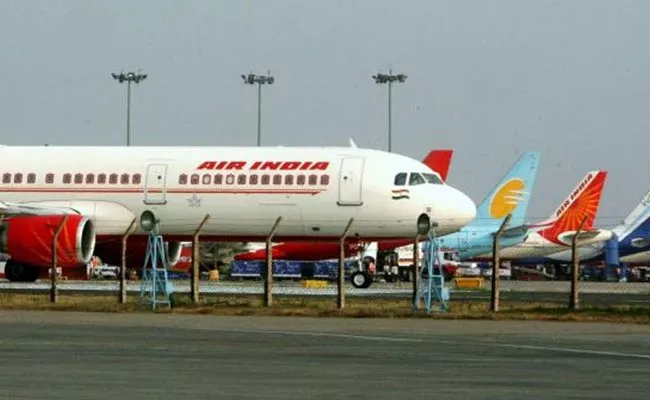 Air India stops Promotions Appointments as govt prepares to sell stake - Sakshi
