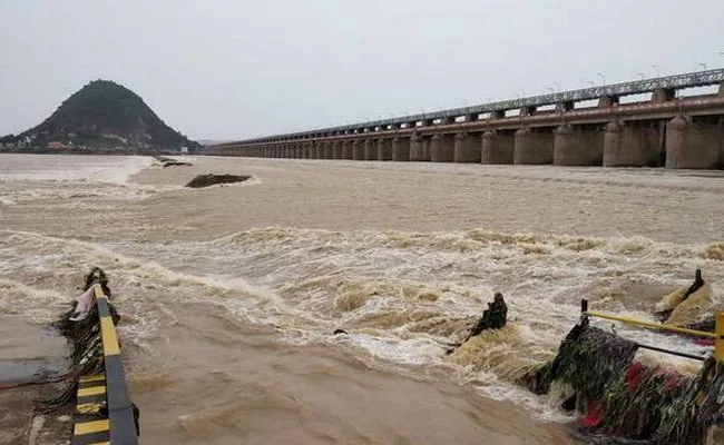 Heavy Water Flow In Prakasam Barrage - Sakshi