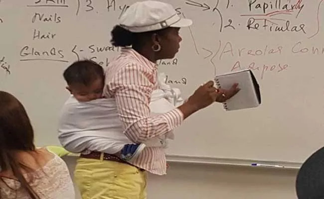 Professor Helps Student To Carry Her Boy In Georgia - Sakshi