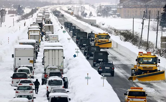 Japan 1000 Drivers Stuck in 40 Hour Traffic Jam Heavy Snowstorm - Sakshi