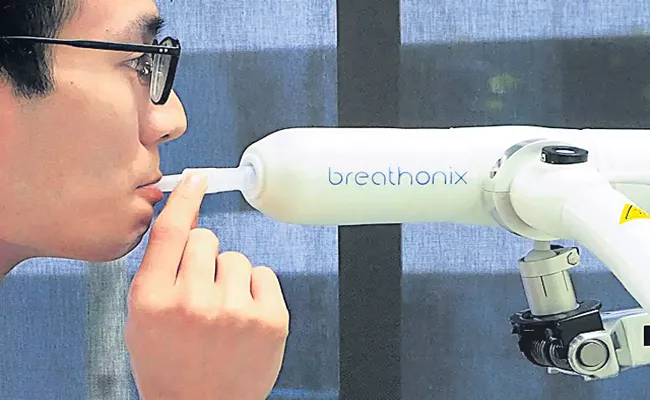 Singapore approves Covid breath test that gives results in a minute - Sakshi