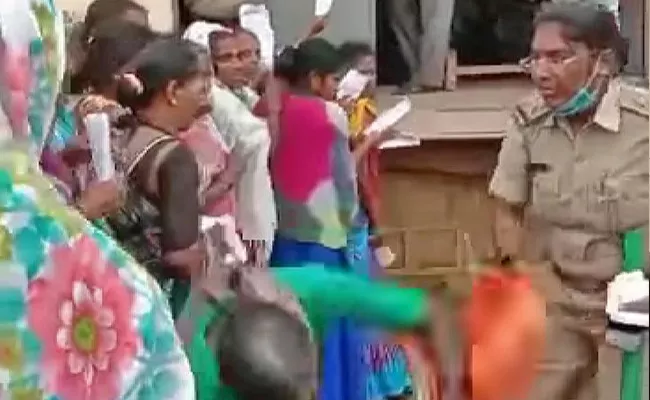 Pushed By Woman Sub Inspector, Farmer Falls Down - Sakshi