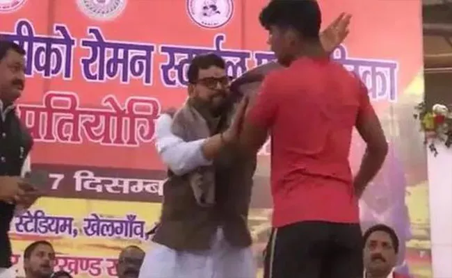 Viral Video:  BJP MP Slapping Wrestler On Stage At Sports Event - Sakshi