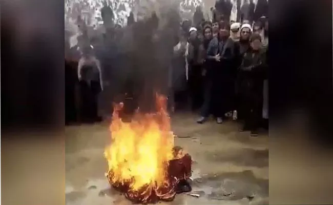Taliban Burned Musical Instrument In Front Of Afghan Musician In Afghanistan Video Goes Viral - sakshi - Sakshi