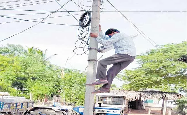 Telangana: Shoes Makes Easier To Climb Current Pole For Lineman - Sakshi