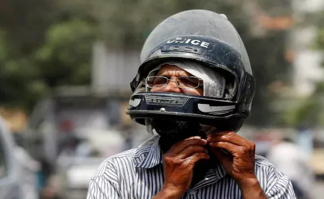 Wearing Helmet Unstrapped And Without ISI Mark Will Fined - Sakshi