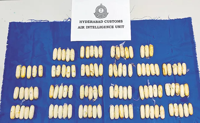 Customs officials Drug capsules Shamshabad International Airport - Sakshi