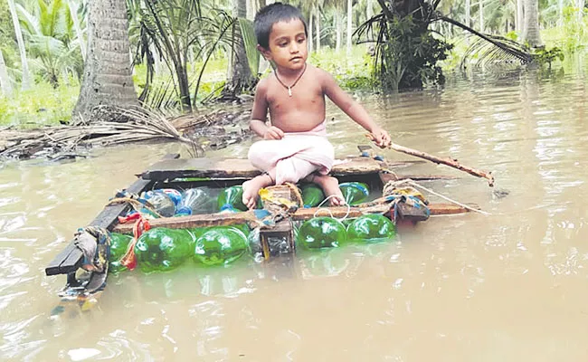 Konaseema District: Bottles Boat For Kids in Amalapuram, Flood, Boats - Sakshi