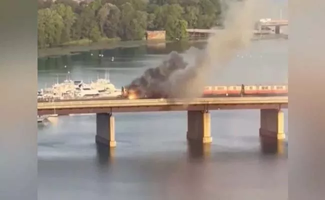 Viral Video: Boston Train Catches Fire Atop Bridge Woman Jumps Into River - Sakshi