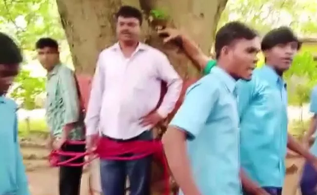 A Teacher Tied To Tree Thrashed By Students For Giving Poor Marks - Sakshi