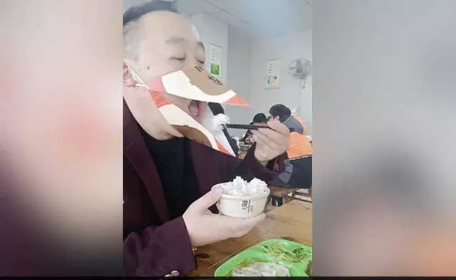 Viral Video: Man Eating With Beak Shaped Mask Gone Viral  - Sakshi