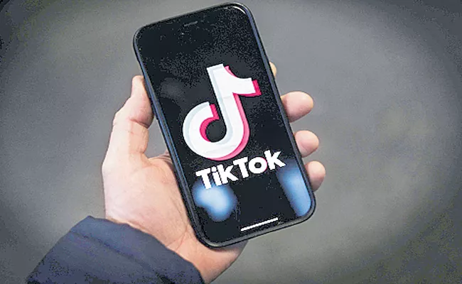 Britain bans TikTok on government devices over security concerns - Sakshi