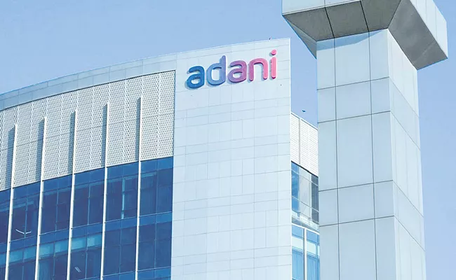 Adani Group sells Rs 15,446 cr stake to US equity boutique GQG Partners - Sakshi