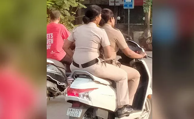 Twitter User Shares Photo Woman Cops Riding Scooter Without Helmet - Sakshi