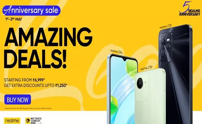 Realme 5th anniversary sale smartphones TVs and other products check offers - Sakshi