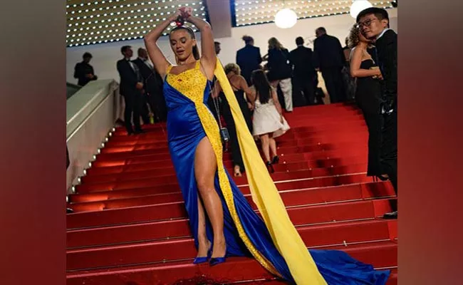 Woman Pours Fake Blood On Self At Cannes Red Carpet Video Goes Viral - Sakshi