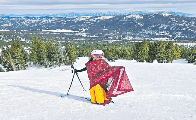 NRI woman goes skiing wearing a saree in viral - Sakshi