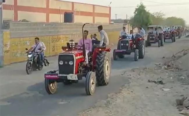 Viral Video: Rajasthan Groom Drives To Wedding Venue With 51 Tractors  - Sakshi