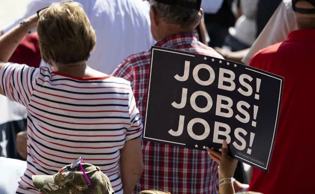 US jobless claims hold steady at 20 month high - Sakshi