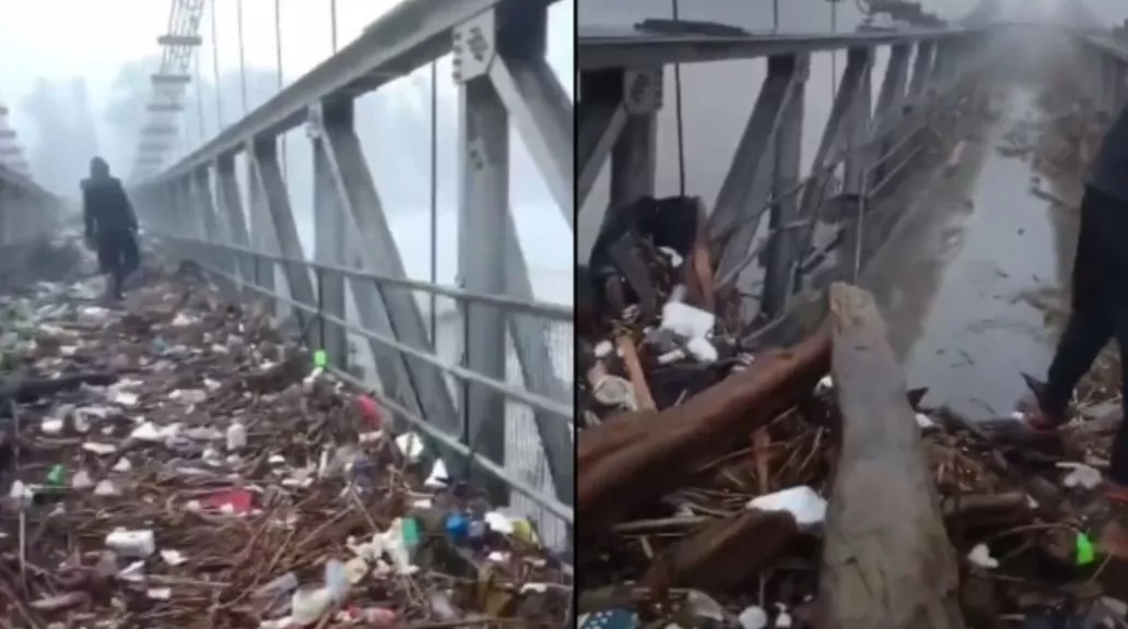 River Throws Back Heaps Of Trash On Bridge Officer Shares Video - Sakshi