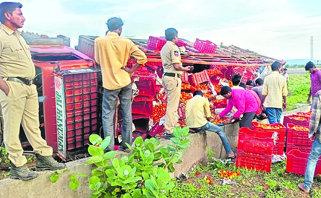 363 highway above tomato and egg vehicles overturned at different places - Sakshi