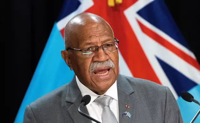 Fiji Prime Minister Trips While Looking At Phone  Cancel China Visit - Sakshi