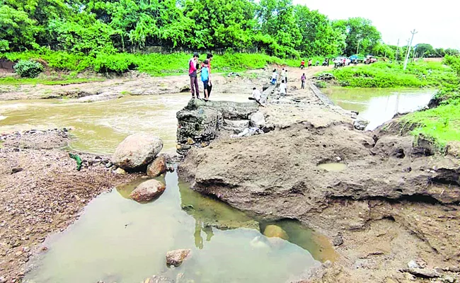 Road washed away by heavy rains - Sakshi