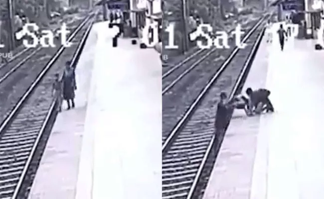 Railway Worker Saved the Childs Life - Sakshi
