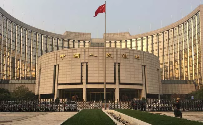 China central bank cuts rates for second time in three months to support economy - Sakshi