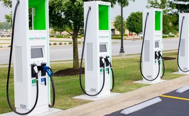 Adani Total Energies E Mobility Evera Cabs to develop charging hubs - Sakshi
