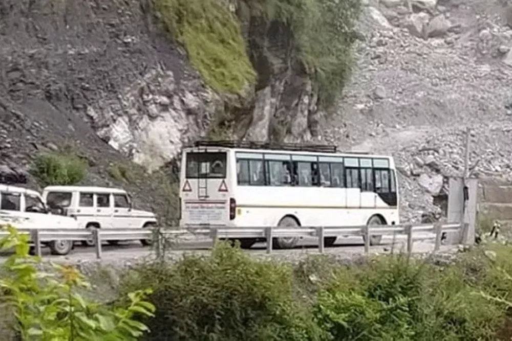 Uttarakhand  Rains Tourists Vehicles Struck On Road For Hours  - Sakshi