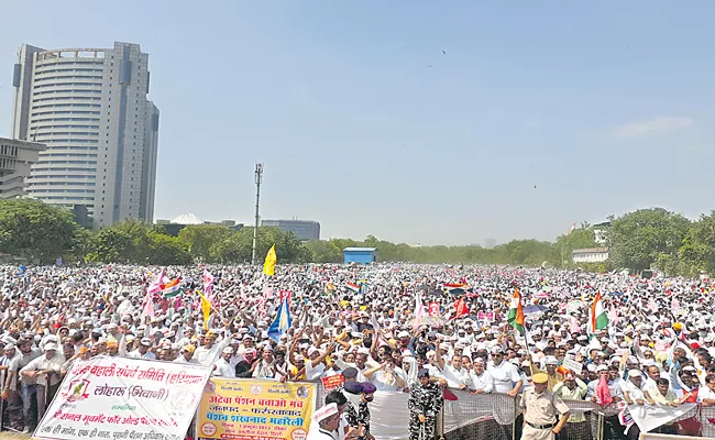Government employees hold rally in Delhi seeking restoration of old pension scheme - Sakshi