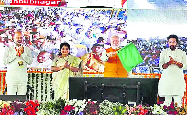 PM Narendra modi flags off the new  train service between kachiguda ralchur from krishna station via video conferencing - Sakshi