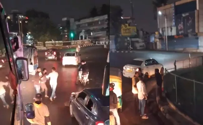 Viral video Bengaluru traffic boils over as men thrash each other at red light - Sakshi