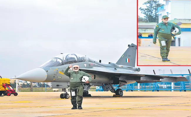 PM Modi Takes Flight In Tejas Fighter During Visit To Hindustan Aeronautics Limited - Sakshi