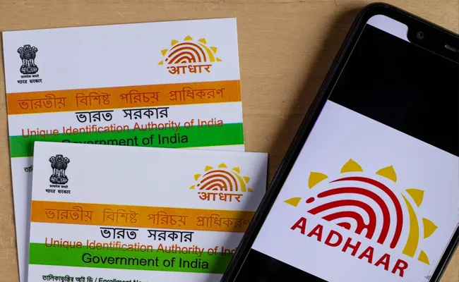 Uidai Imposes Rs 50,000 Penalty For Overcharging Aadhaar Services - Sakshi