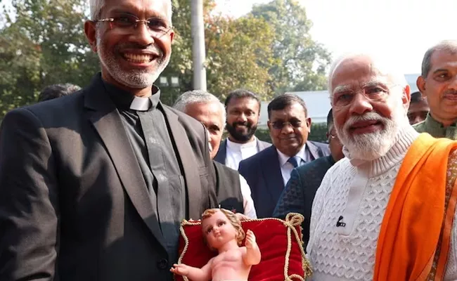 PM Modi At Christmas Programme Praise Jesus Christ Ideals - Sakshi