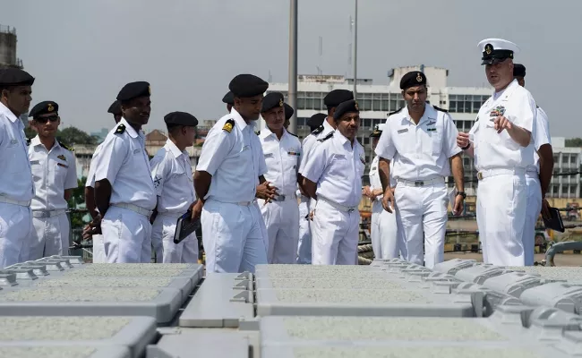 Qatar court reduces punishment for 8 ex-Indian Navy veterans on death row - Sakshi