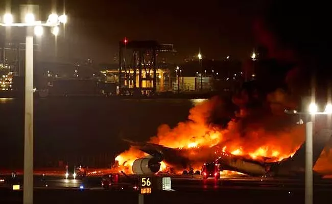 Video: Flight catches fire on Tokyo airport Runway After Collision - Sakshi