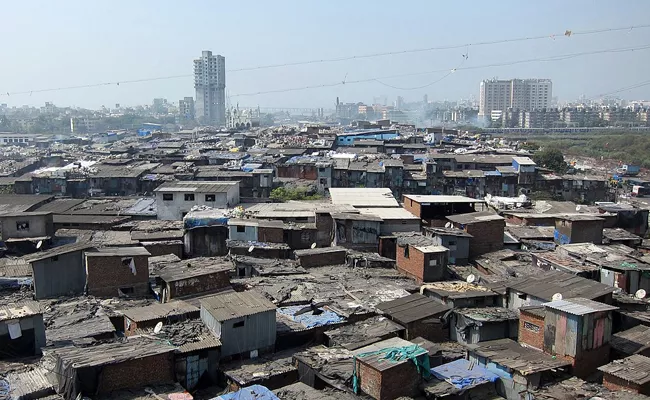 free homes in redeveloped Dharavi Adani to start key survey in February - Sakshi