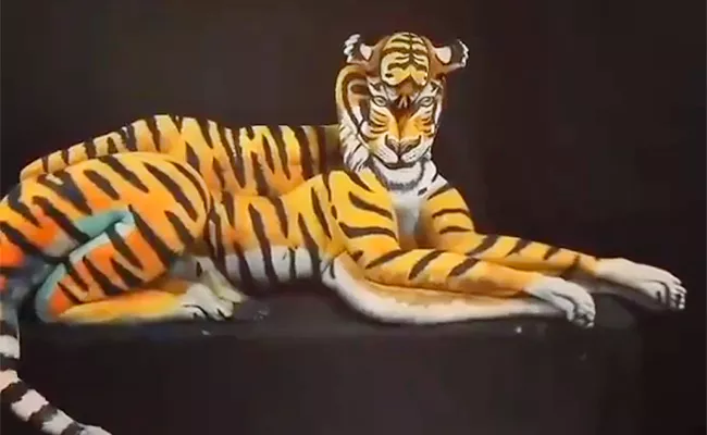 Amazing animal body art illusion by 4 girls - Sakshi