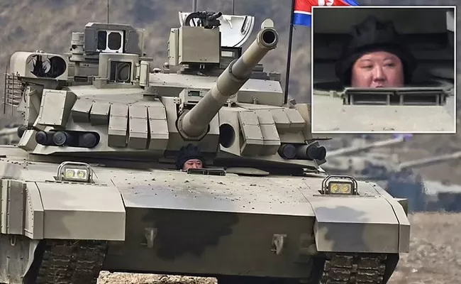 North Korea Kim drives newly developed battle tank during launch drill - Sakshi