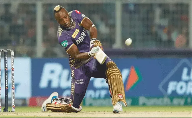 Andre Russell smashes three sixes in an over against SRH spinner Mayank Markande - Sakshi