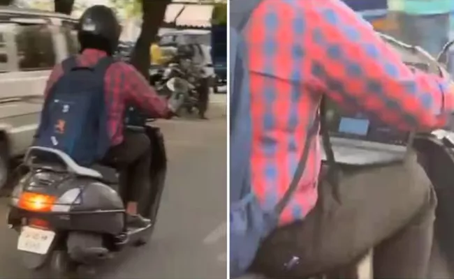 Bengaluru man attends work call while riding scooty - Sakshi